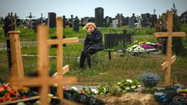 A woman mourns while visiting the grave of Stanislav Hvostov, 22, a Ukrainian serviceman killed during the Russian invasion of Ukraine, in the military section of the Kharkiv cemetery number 18 in Bezlioudivka, eastern Ukraine. AFP A woman mourns while visiting the grave of Stanislav Hvostov, 22, a Ukrainian serviceman killed during the Russian invasion of Ukraine, in the military section of the Kharkiv cemetery number 18 in Bezlioudivka, eastern Ukraine. AFP