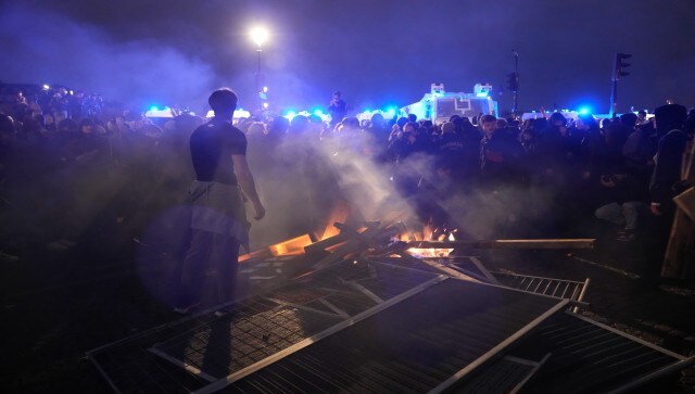 Riot police charged and threw tear gas to empty the huge square across from the National Assembly after troublemakers climbed scaffolding on a renovation site, arming themselves with wood. They lobbed fireworks and paving stones at police in a standoff. AP Riot police charged and threw tear gas to empty the huge square across from the National Assembly after troublemakers climbed scaffolding on a renovation site, arming themselves with wood. They lobbed fireworks and paving stones at police in a standoff. AP
