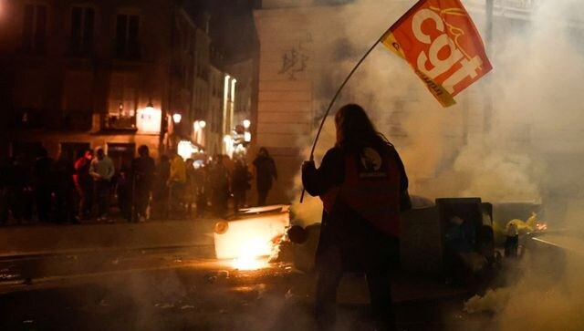 Police fire tear gas at spontaneous anti-pension bill protest in Paris