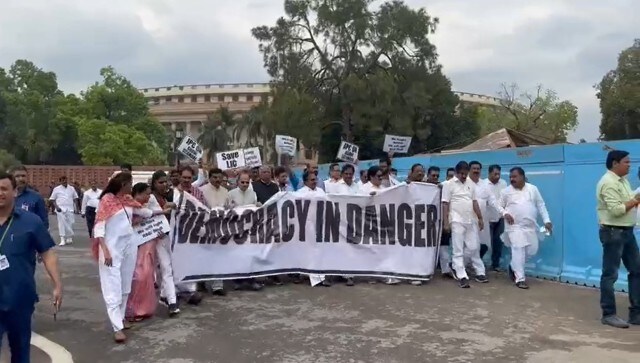 Holding a huge “democracy in danger” banner, opposition parties led by the Congress marched today towards the Rashtrapati Bhavan from Vijay Chowk. The substantial security presence was intended to prevent the leaders from reaching their destination, reported NDTV. Image Courtesy: @INCIndia/Twitter Holding a huge “democracy in danger” banner, opposition parties led by the Congress marched today towards the Rashtrapati Bhavan from Vijay Chowk. The substantial security presence was intended to prevent the leaders from reaching their destination, reported NDTV. Image Courtesy: @INCIndia/Twitter