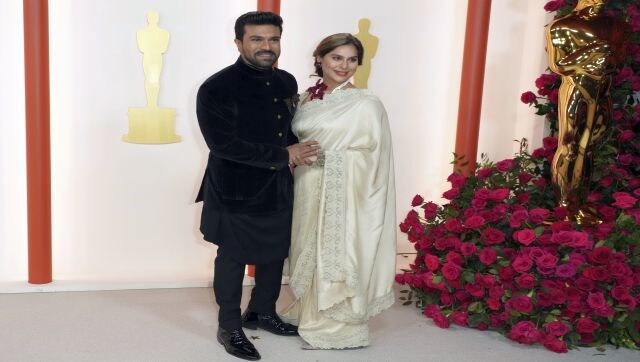 RRR actor Ram Charan brought Indian style to the Oscar carpet. He wore a black three-piece sherwani — the jacket had a bandhgala collar, padded shoulders, full-length sleeves, front gold-toned button closures, a stylish brooch and a tailored fitting, while the kurta came with a draped silhouette and an asymmetric hem. AP RRR actor Ram Charan brought Indian style to the Oscar carpet. He wore a black three-piece sherwani — the jacket had a bandhgala collar, padded shoulders, full-length sleeves, front gold-toned button closures, a stylish brooch and a tailored fitting, while the kurta came with a draped silhouette and an asymmetric hem. AP