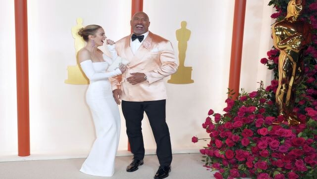 Emily Blunt was a sight to behold in her elegant white Valentino gown. Dwayne Johnson was style goals in his ballet pink Dolce & Gabbana suit. AP Emily Blunt was a sight to behold in her elegant white Valentino gown. Dwayne Johnson was style goals in his ballet pink Dolce & Gabbana suit. AP