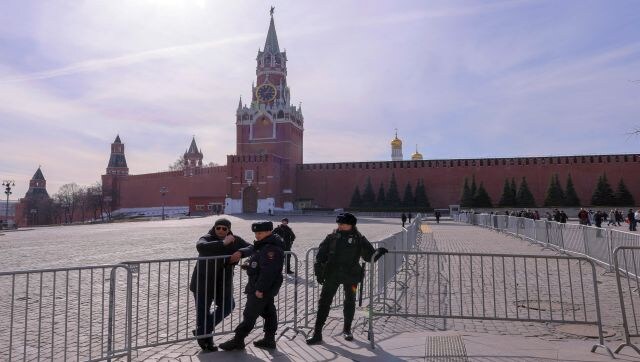 Law enforcement officers stand guard next to barrier constructions installed near the Kremlin. Reuters Law enforcement officers stand guard next to barrier constructions installed near the Kremlin. Reuters