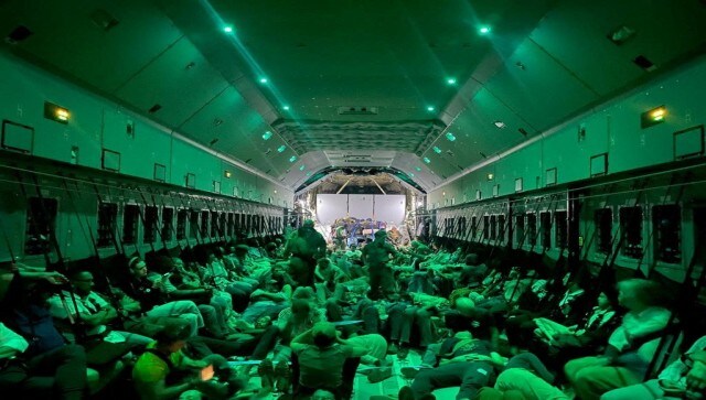 Spanish diplomatic personnel and citizens wait to disembark a military plane after they were evacuated from Sudan, in Djibouti. Reuters