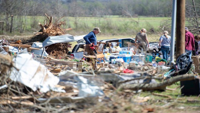 President Biden earlier declared broad areas of the country major disaster areas, making federal resources and financial aid available for recovery. Governor Sarah Huckabee Sanders in Arkansas, where at least five people were killed, already had declared a state of emergency and activated the National Guard. AP