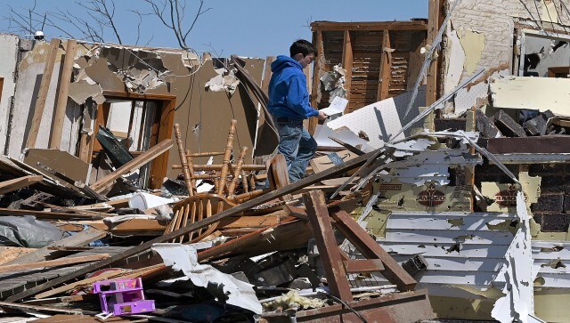 “While we are still assessing the full extent of the damage, we know families across America are mourning the loss of loved ones, desperately waiting for news of others fighting for their lives, and sorting through the rubble of their homes and businesses,” US president Joe Biden said in a statement. AP