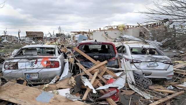 The storms tore a path through the Arkansas capital and also tore down the roof of a packed concert venue in Illinois, stunning people throughout the region with the scope of the damage. The number of deaths continued to grow on Sunday. AP
