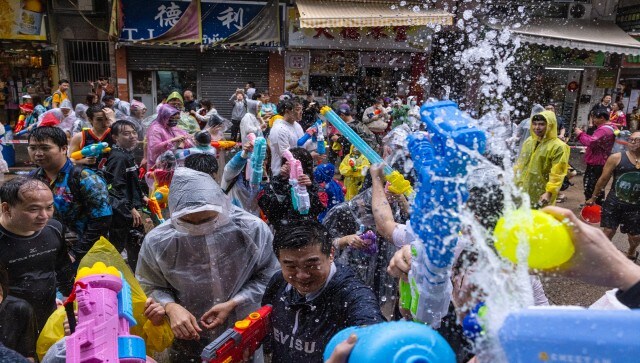 The Thai New Year is celebrated during Songkran when the traditional custom of splashing water to wash away sins and bad luck has evolved into vibrant and spectacular public water fights. AP
