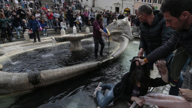 WATCH: Climate activists turn landmark Rome fountain black