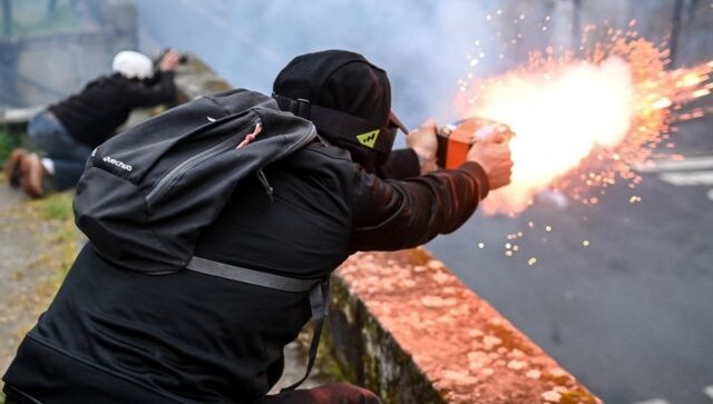 In Nantes, western France, violence broke out at some places as protesters clashed with the police and set waste bins on fire. Anti-riot police officers were deployed in the city, while a protester was seen using fireworks towards them. AFP In Nantes, western France, violence broke out at some places as protesters clashed with the police and set waste bins on fire. Anti-riot police officers were deployed in the city, while a protester was seen using fireworks towards them. AFP