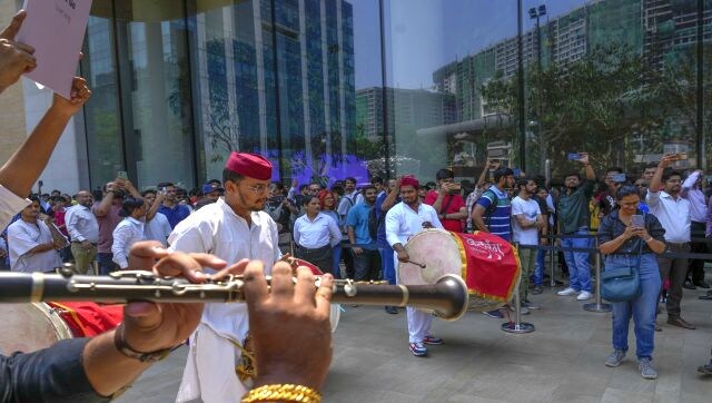 The store located in the heart of Mumbai opened to the beats of the Nashik dhol and cheers from employees within and customers lined up outside the store. People had lined up outside the store since the wee hours of the morning, many travelling from as far as Bangalore to be part of the launch event. AP The store located in the heart of Mumbai opened to the beats of the Nashik dhol and cheers from employees within and customers lined up outside the store. People had lined up outside the store since the wee hours of the morning, many travelling from as far as Bangalore to be part of the launch event. AP