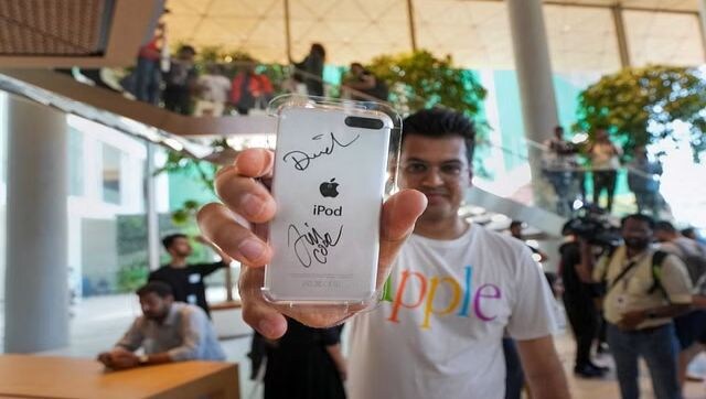 A man shows off with his phone after it was signed by Tim Cook. Incidentally, Apple BKC is designed to be one of the most energy-efficient Apple Store locations, with a dedicated solar array and zero reliance on fossil fuels. The store is operationally carbon neutral, running on 100 per cent renewable energy. PTI A man shows off with his phone after it was signed by Tim Cook. Incidentally, Apple BKC is designed to be one of the most energy-efficient Apple Store locations, with a dedicated solar array and zero reliance on fossil fuels. The store is operationally carbon neutral, running on 100 per cent renewable energy. PTI