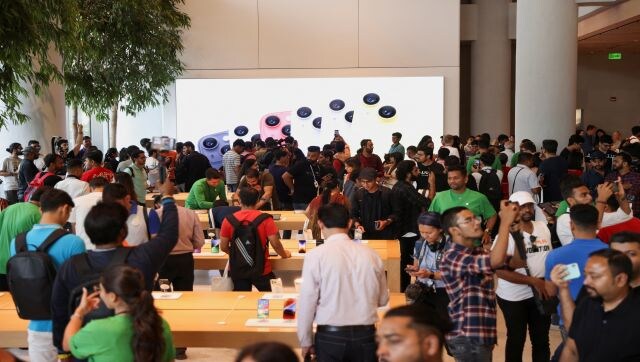 People are seen inside India’s first Apple retail store in Mumbai. Contrary to expectations, the store did not have any launch day offers. However, customers on the first day got a bespoke Apple tote bag with the Apple BKC store’s customised logo, and a sticker of the logo. Reuters People are seen inside India’s first Apple retail store in Mumbai. Contrary to expectations, the store did not have any launch day offers. However, customers on the first day got a bespoke Apple tote bag with the Apple BKC store’s customised logo, and a sticker of the logo. Reuters