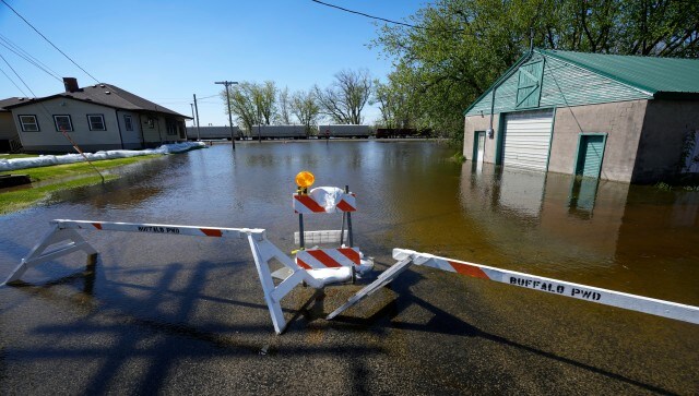 Some roads and parks near the river are closed. The record at that spot is 22.7 feet (6.9 meters). The flood stage at that part of the river is 15 feet (4.57 metres). Two minor levee breaks were reported over the weekend near a wildlife refuge south of Bellevue, Iowa, and in Camanche, Iowa, that covered a couple of streets with water, AP Some roads and parks near the river are closed. The record at that spot is 22.7 feet (6.9 meters). The flood stage at that part of the river is 15 feet (4.57 metres). Two minor levee breaks were reported over the weekend near a wildlife refuge south of Bellevue, Iowa, and in Camanche, Iowa, that covered a couple of streets with water, AP