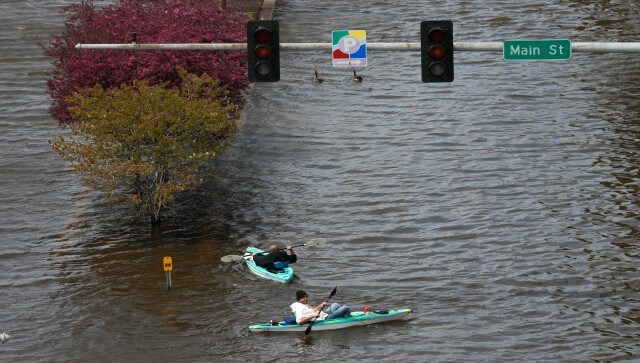 Kayakers float down a flooded street in downtown Davenport. Forecasts call for little rain in the coming ten days, so once the river crests it should soon begin a slow decline that will last for at least two weeks. AP Kayakers float down a flooded street in downtown Davenport. Forecasts call for little rain in the coming ten days, so once the river crests it should soon begin a slow decline that will last for at least two weeks. AP