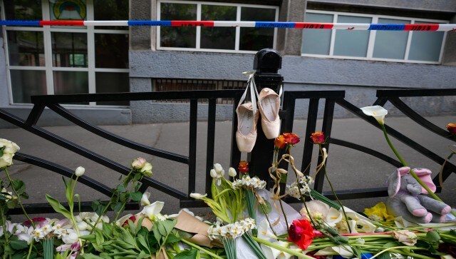 Ballet shoes, flowers and toys are placed in memory of the victims in front of the Vladislav Ribnikar school in Belgrade. Police said the teenager had planned the attack for a month, drew sketches of classrooms and made lists of children he planned to kill. The boy, who had visited shooting ranges with his father, took two guns from his father’s safe, police said on Wednesday. AP