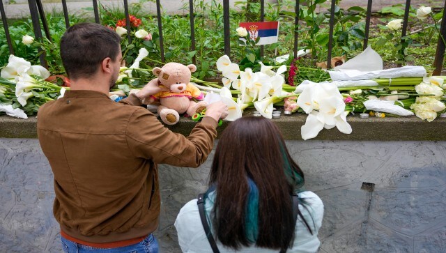 Thousands of people in Belgrade and other cities throughout the Balkan country lined up to lay flowers, light candles and leave toys to commemorate the victims of the shooting that occurred in a central district in the Serbian capital on Wednesday morning. AP