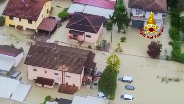 This aerial photo provided by the Italian Firefighters shows firefighters show flooded houses in Cesena, in the northern Italian region of Emilia Romagna. An older man died in his flooded home in the countryside outside of Cesena, while his wife managed to make it to safety, Italian state radio said early Wednesday. AP This aerial photo provided by the Italian Firefighters shows firefighters show flooded houses in Cesena, in the northern Italian region of Emilia Romagna. An older man died in his flooded home in the countryside outside of Cesena, while his wife managed to make it to safety, Italian state radio said early Wednesday. AP