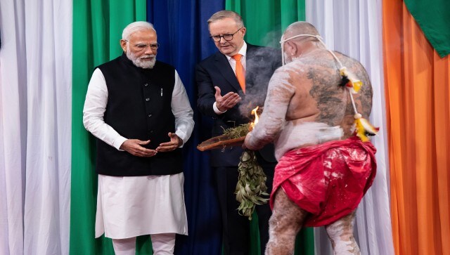 Prime Minister Narendra Modi and Australian prime minster Anthony Albanese are welcomed by an Aboriginal man as they arrive for the Indian community event in Sydney. AP Prime Minister Narendra Modi and Australian prime minster Anthony Albanese are welcomed by an Aboriginal man as they arrive for the Indian community event in Sydney. AP