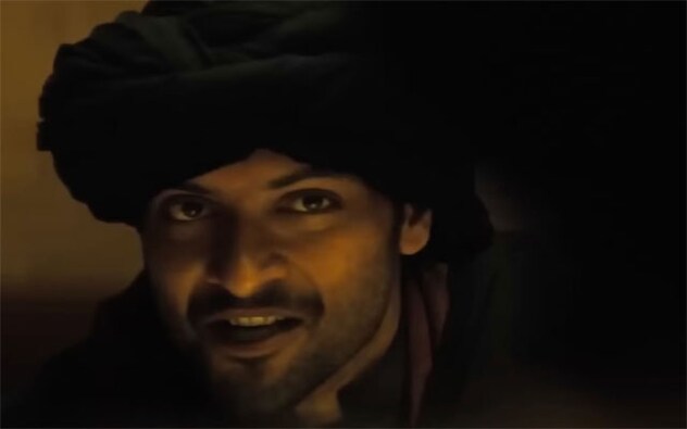 Since the time the trailer of Ali Fazal’s Hollywood movie Kandahar was released, there have been a lot of questions surrounding Ali’s role in the movie. The trailer clearly shows glimpses and silhouettes of Ali Fazal in the middle of the desert riding a dirt bike, getting off a helicopter, but a lot of is kept Ali as the mystery man in the film. The trailer features many shots of a man doing stunts, riding a bike in the desert, getting off a helicopter. This suave, stylish man is our very own Ali Fazal, who is playing a major role in the Gerard Butler starrer. Shot extensively in Saudi Arabia, the trailer’s mystery man has everyone talking and the makers are keeping Ali’s role under wraps as they want it to have a high impact as his role has him doing some high octane stunts and action.