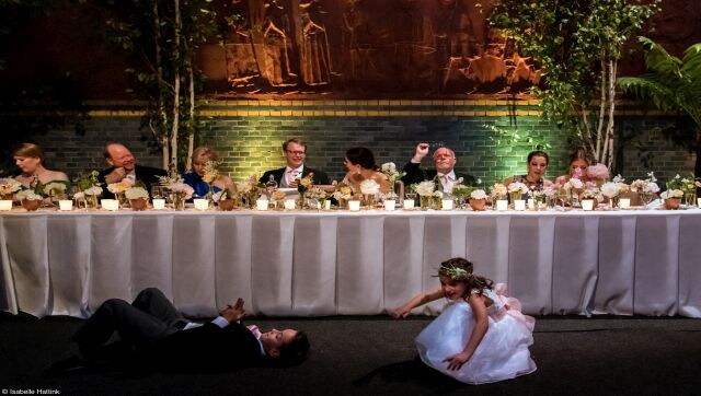 Stories During Dinner: Kids playing around the family table at a wedding. Image Courtesy: Isabelle Hattink/Pink Lady® Food Photographer of the Year 2023