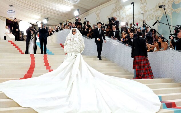 Rihanna shut down the Met Gala carpet Monday encased in white camellias on a jacket with a long train gown. Janelle Monáe dropped a bulky coat to reveal a see-through cage and Jeremy Pope walked in a 32-foot cape emblazoned with the visage of Karl Lagerfeld. Rihanna shut down the Met Gala carpet Monday encased in white camellias on a jacket with a long train gown. Janelle Monáe dropped a bulky coat to reveal a see-through cage and Jeremy Pope walked in a 32-foot cape emblazoned with the visage of Karl Lagerfeld.