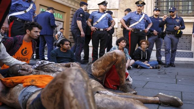 Elsewhere in Rome, environmental activists from the ‘Last Generation’ group covered themselves in mud in front of the Italian Senate in Rome to protest fossil fuels and the consequences of climate change. AP Elsewhere in Rome, environmental activists from the ‘Last Generation’ group covered themselves in mud in front of the Italian Senate in Rome to protest fossil fuels and the consequences of climate change. AP