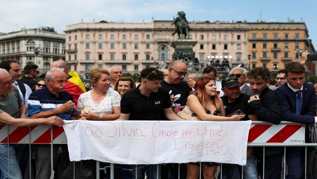 People wait for the funeral of former Italian Prime Minister Silvio Berlusconi. Supporters of Berlusconi’s legacy cite his success in unifying the Italian center-right after the collapse of the post-war political landscape with the 1990s “Clean Hands” corruption scandal. Reuters