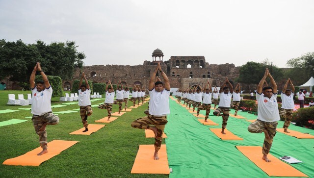 People pose for the camera as they perform yoga on International Yoga Day at Purana Qila, or Old Fort in New Delhi. Notably, the theme for the International Day of Yoga this year is ‘Yoga for Vasudhaiva Kutumbakam’ or ‘Yoga for the Welfare of All as One World-One Family.’ Reuters People pose for the camera as they perform yoga on International Yoga Day at Purana Qila, or Old Fort in New Delhi. Notably, the theme for the International Day of Yoga this year is ‘Yoga for Vasudhaiva Kutumbakam’ or ‘Yoga for the Welfare of All as One World-One Family.’ Reuters