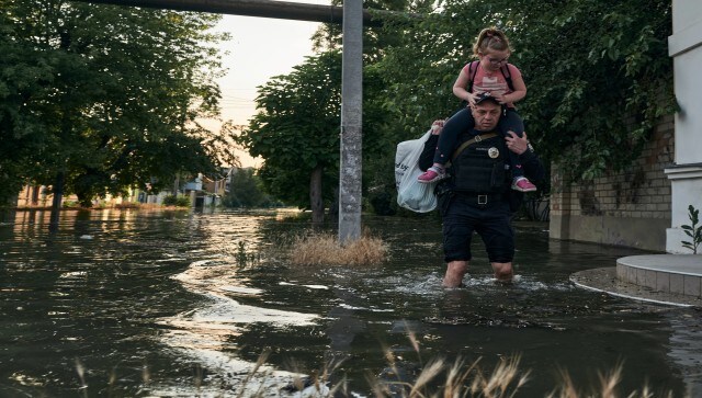 The unnerving bark of dogs left behind further soured the mood of those ferried to safety. A woman in one raft clutched the head of her despondent daughter. A stalled military truck stuck in swelling waters raised the panic level as Red Cross teams tried to manage an orderly evacuation. AP