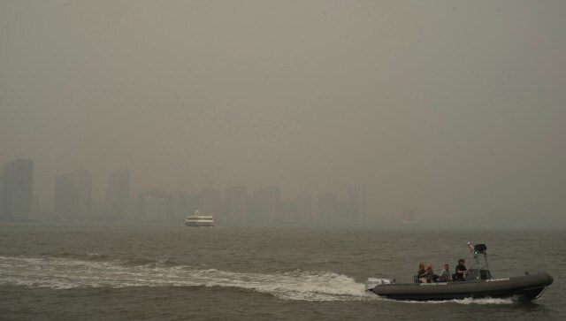 Buildings in New Jersey obscured by smoke as boats travel on the Hudson River, seen from the Manhattan borough. Across the eastern US, officials warned residents to stay inside and limit or avoid outdoor activities again Thursday, extending “Code Red” air quality alerts in some places for a third-straight day as forecasts showed winds continuing to push smoke-filled air south. AP Buildings in New Jersey obscured by smoke as boats travel on the Hudson River, seen from the Manhattan borough. Across the eastern US, officials warned residents to stay inside and limit or avoid outdoor activities again Thursday, extending “Code Red” air quality alerts in some places for a third-straight day as forecasts showed winds continuing to push smoke-filled air south. AP