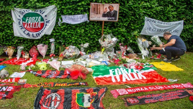People lay down flowers for the deceased Berlusconi in Monza. Nevertheless, thousands of Italians are expected to fill the piazza outside Milan’s Duomo to follow the funeral on two maxi-screens, while family members, political allies and opponents gather inside. AP
