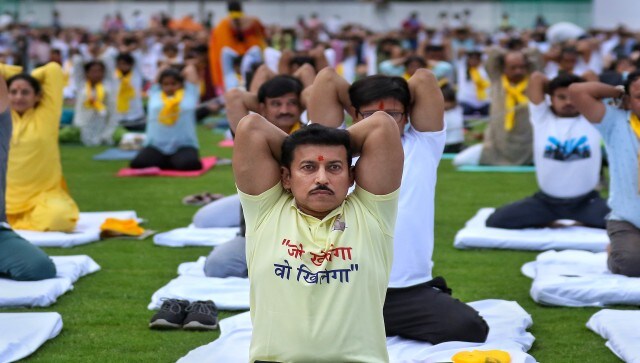 BJP MP Rajyavardhan Singh Rathore twists and bends Yoga Day, at the Maharana Pratap Sports College, in Jaipur. PTI BJP MP Rajyavardhan Singh Rathore twists and bends Yoga Day, at the Maharana Pratap Sports College, in Jaipur. PTI