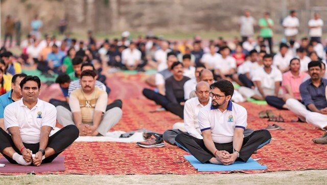 Union Minister for Youth Affairs and Sports Anurag Thakur performs yoga during a session on International Day of Yoga, in Hamirpur. Union ministers Hardeep Singh Puri, Mansukh Mandviya, and Piyush Goyal, as well as Delhi Lieutenant Governor VK Saxena also attended yoga activities in the city. Image Courtesy: @ianuragthakur/Twitter Union Minister for Youth Affairs and Sports Anurag Thakur performs yoga during a session on International Day of Yoga, in Hamirpur. Union ministers Hardeep Singh Puri, Mansukh Mandviya, and Piyush Goyal, as well as Delhi Lieutenant Governor VK Saxena also attended yoga activities in the city. Image Courtesy: @ianuragthakur/Twitter