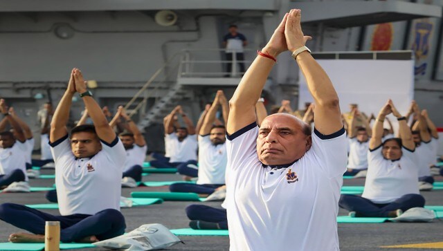 Defence Minister Rajnath Singh performs different yoga asanas with Indian Navy personnel onboard India’s first indigenous aircraft carrier, INS Vikrant, in Kochi. After an hour of yoga, the defence minister interacted with the participants and hailed the ancient practice. Image Courtesy: @rajnathsingh/Twitter Defence Minister Rajnath Singh performs different yoga asanas with Indian Navy personnel onboard India’s first indigenous aircraft carrier, INS Vikrant, in Kochi. After an hour of yoga, the defence minister interacted with the participants and hailed the ancient practice. Image Courtesy: @rajnathsingh/Twitter