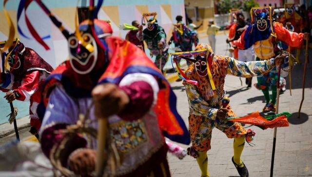 Hundreds gathered in the streets of Venezuela to mark the annual commemoration of Corpus Christi on Thursday (8 June). During this, communities along the central coastal region of the country take part in the festival of the Dancing Devils. AP