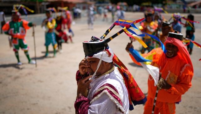 Corpus Christi is a Roman Catholic movable feast day that celebrates the transfiguration of the body and blood of Jesus Christ into bread and wine. During the festival, dancers pledge to the Holy Sacrament in exchange for blessings. AP