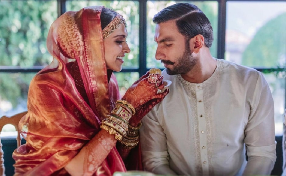 For the Konkani ceremony, Deepika wore a red and gold silk saree which was accentuated by her heavy bridal jewellery. Ranveer kept it simple with a white and gold kurta. Image via Twitter/@RanveerOfficial For the Konkani ceremony, Deepika wore a red and gold silk saree which was accentuated by her heavy bridal jewellery. Ranveer kept it simple with a white and gold kurta. Image via Twitter/@RanveerOfficial