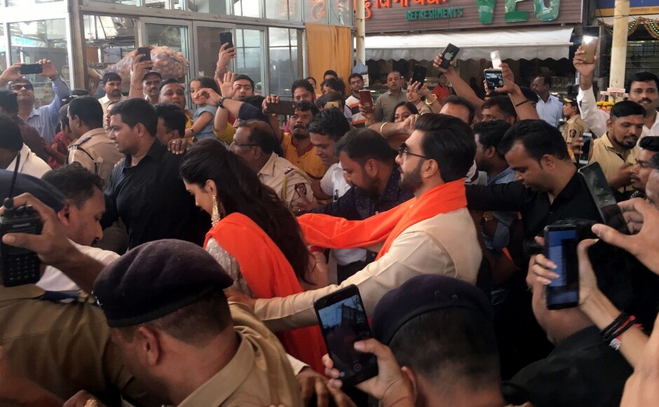 Ranveer Singh escorts wife Deepika Padukone through a crowd of fans thronging the couple. Sachin Gokhale Ranveer Singh escorts wife Deepika Padukone through a crowd of fans thronging the couple. Sachin Gokhale