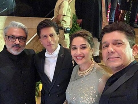 Shah Rukh Khan reunites with Devdas co-star Madhuri Dixit, director Sanjay Leela Bhansali at DeepVeer reception Shah Rukh Khan reunites with Devdas co-star Madhuri Dixit, director Sanjay Leela Bhansali at DeepVeer reception