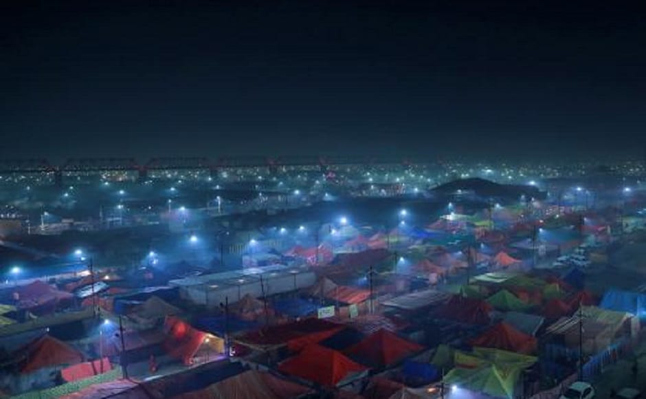 Ahead of the festival's start, pilgrims moved towards temporary ashrams built of corrugated iron and canvas, many bedecked with fairy lights, on the east bank of the Ganges. Reuters