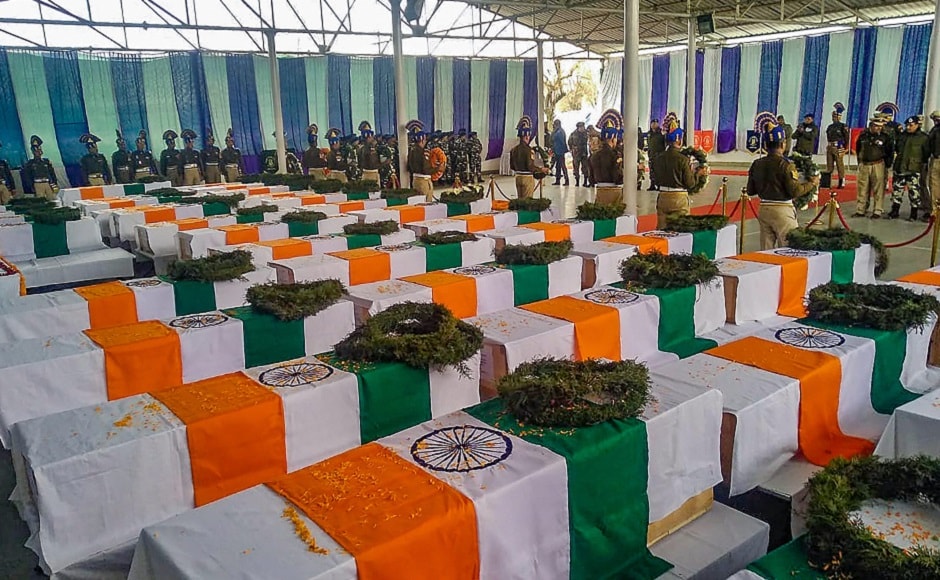 After the dignitaries paid their homage, the prime minister, dressed in white with a dark-coloured shawl, arrived in the hanger and went straight to the podium where the coffins were kept. PTI After the dignitaries paid their homage, the prime minister, dressed in white with a dark-coloured shawl, arrived in the hanger and went straight to the podium where the coffins were kept. PTI