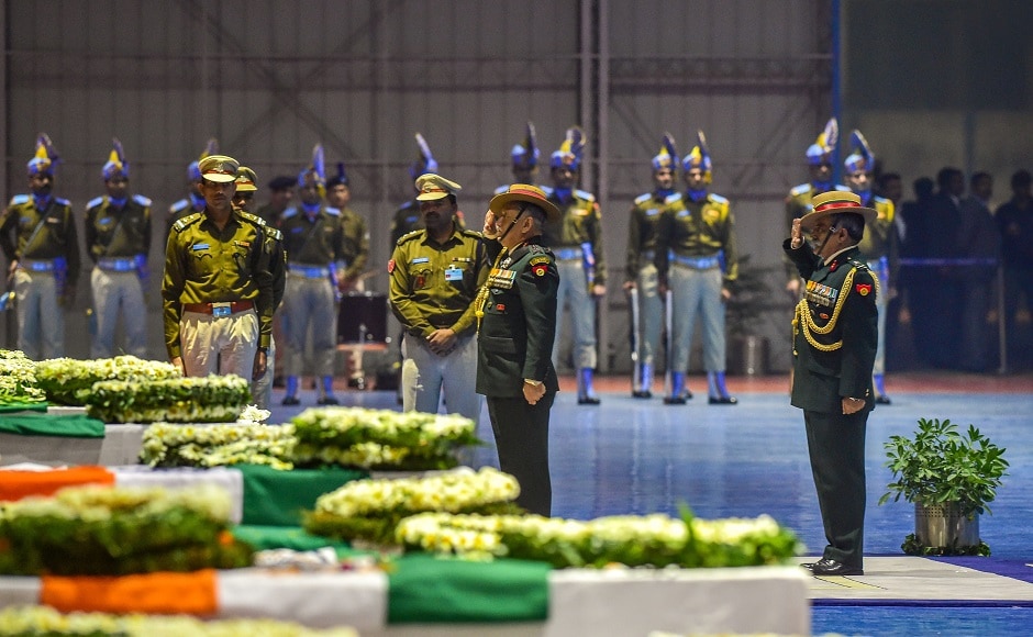 Decorated with white floral arrangements, 40 coffins wrapped in tricolour were neatly arranged in the hanger, where senior officials of the CRPF laid wreaths one by one in a solemn ceremony. PTI Decorated with white floral arrangements, 40 coffins wrapped in tricolour were neatly arranged in the hanger, where senior officials of the CRPF laid wreaths one by one in a solemn ceremony. PTI
