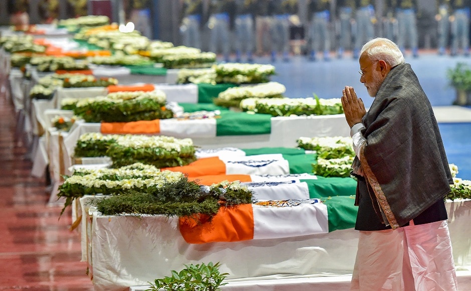 With his hands folded and head bowed, Prime Minister Narendra Modi walked around 40 coffins draped in tricolour on Friday evening as he led the nation in paying last respects to the CRPF personnel killed in the Pulwama terror attack. PTI With his hands folded and head bowed, Prime Minister Narendra Modi walked around 40 coffins draped in tricolour on Friday evening as he led the nation in paying last respects to the CRPF personnel killed in the Pulwama terror attack. PTI