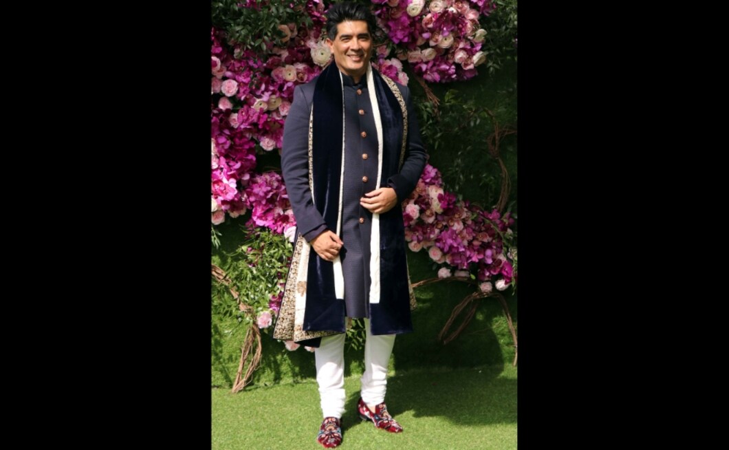 Designer Manish Malhotra looked dapper in a deep blue kurta for Akash and Shloka's wedding. Photo: Sachin Gokhale Designer Manish Malhotra looked dapper in a deep blue kurta for Akash and Shloka's wedding. Photo: Sachin Gokhale
