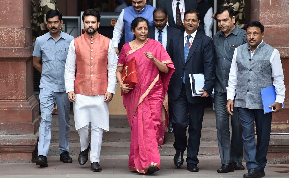 Minister of State Finance Anurag Thakur, Finance Secretary SC Garg, Chief Economic Adviser Subramanian and other officials were present with Sitharaman outside the Finance Ministry. PTI Minister of State Finance Anurag Thakur, Finance Secretary SC Garg, Chief Economic Adviser Subramanian and other officials were present with Sitharaman outside the Finance Ministry. PTI
