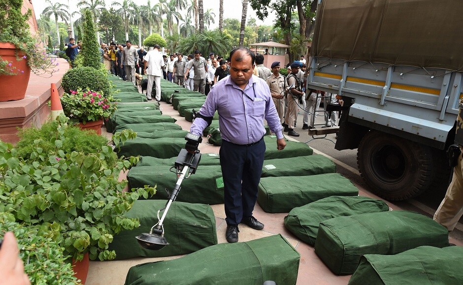 A security personnel checks sacks containing copies of Union Budget 2019-20 at Parliament. Sitharaman lowered the fiscal deficit target to 3.3 percent for the current fiscal from the earlier estimate of 3.4 percent of the GDP. PTI A security personnel checks sacks containing copies of Union Budget 2019-20 at Parliament. Sitharaman lowered the fiscal deficit target to 3.3 percent for the current fiscal from the earlier estimate of 3.4 percent of the GDP. PTI
