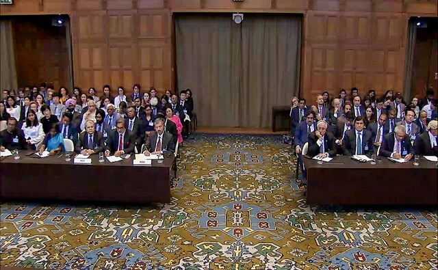 Jadhav, 49, a retired Indian Navy officer, was sentenced to death by a Pakistani military court on charges of "espionage and terrorism" in April 2017 based on an "extracted confession". This image shows Indian and Pakistani officials sitting during the hearing. PTI Jadhav, 49, a retired Indian Navy officer, was sentenced to death by a Pakistani military court on charges of "espionage and terrorism" in April 2017 based on an "extracted confession". This image shows Indian and Pakistani officials sitting during the hearing. PTI