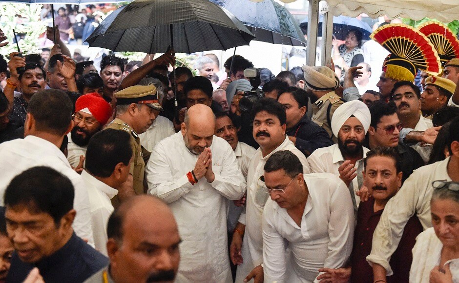 Union Minister Amit Shah, Delhi Chief Minister Arvind Kejriwal, his deputy Manish Sisodia and Delhi home minister Satyendar Jain were among those who attended the last rites. PTI Union Minister Amit Shah, Delhi Chief Minister Arvind Kejriwal, his deputy Manish Sisodia and Delhi home minister Satyendar Jain were among those who attended the last rites. PTI