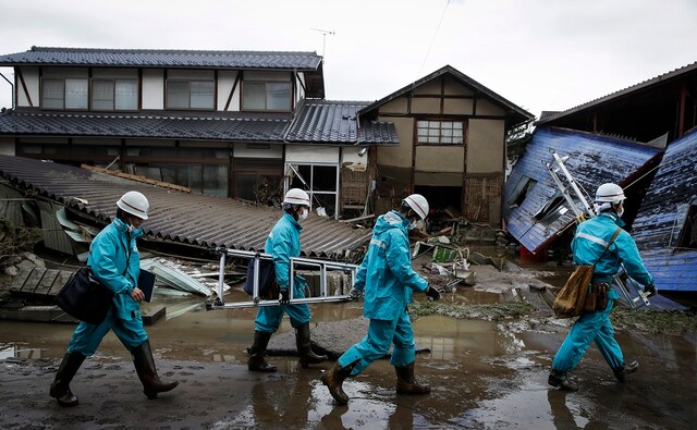 Utility workers surveyed damages in a neighbourhood devastated by the typhoon. Government officials warned that more rain was expected throughout the day on Tuesday in several parts of the country affected by the typhoon. AP Utility workers surveyed damages in a neighbourhood devastated by the typhoon. Government officials warned that more rain was expected throughout the day on Tuesday in several parts of the country affected by the typhoon. AP
